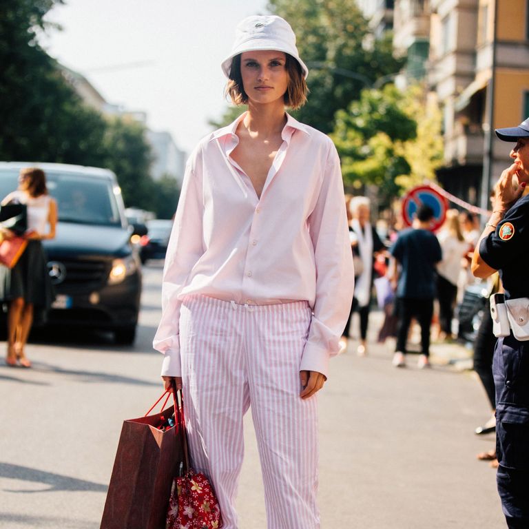 model giedre dukauskaite wears a white lacoste bucket hat news photo 1063139248 1566485922 - The Perfect Button-Down Shirt: Fit, Fabric, Styling, and More